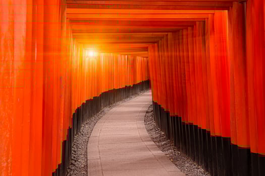 Red torii walk way at Fushimi inari taisha temple Kyoto most popular travel location in Kansai region Japan photo