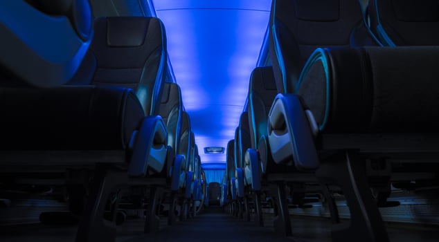 Comfortable Blue Illuminated Coach Bus Interior. photo
