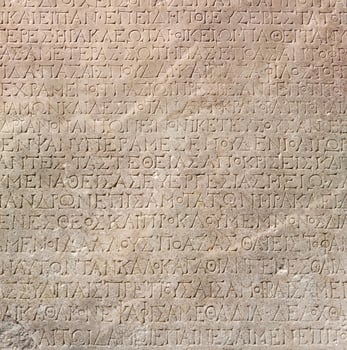 fragment of a marble slab from Chersonesos, Crimea, with a carved text in ancient Greek about the embassy in Rome photo