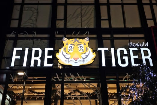 BANGKOK, THAILAND  DECEMBER 21, 2023 Fire Tiger sign. It is a famous bubble tea shops in Thailand. photo