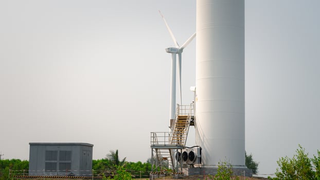 Windmill's turbine gracefully harnesses wind's power, converting it into electricity through generator. Sustainable technology exemplifies promise of renewable energy for greener, ecological future photo