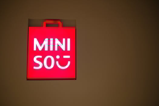 BANGKOK, THAILAND MAY 25, 2023 MINISO light sign. MINISO Co., Ltd is a Chinese low-cost retailer and variety store chain that was founded in 2013. photo