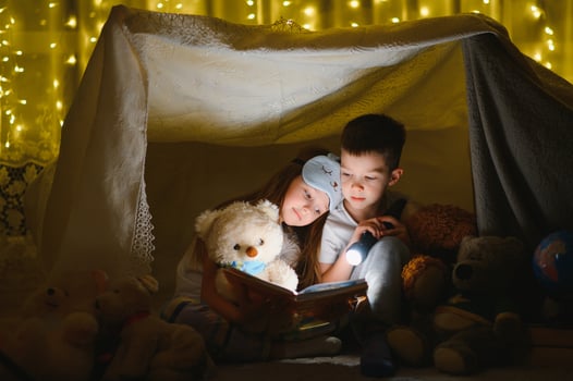 Little children reading bedtime story at home. photo
