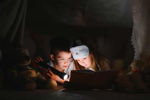 Little children reading bedtime story at home. photo