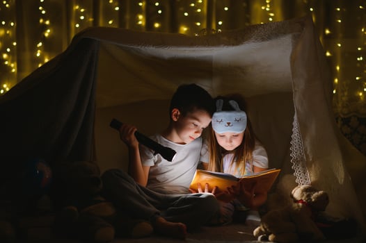 Little children reading bedtime story at home. photo
