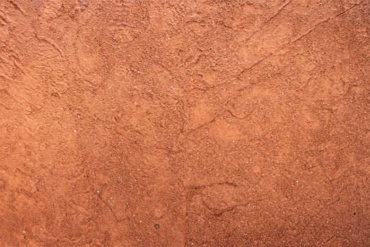 Red sand texture with shoe prints on top photo
