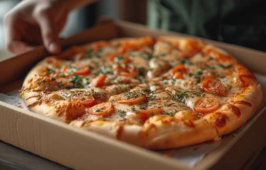 AI generated Open box with delicious pizza in hand photo