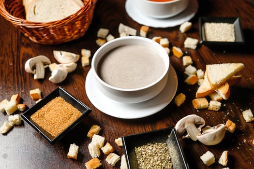 Wooden Table Adorned With Bowls of Food photo
