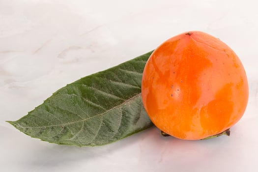 Fresh ripe sweet juicy persimmon photo