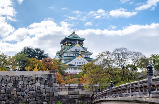 Osaka Castle architecture landmark with bridge gate in autumn season photo