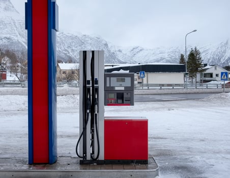 Fuel Dispenser with gas nozzle in gasoline station on winter photo