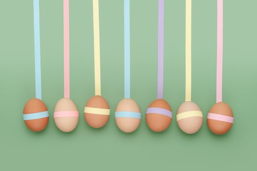 Row of decorated eggs with leading geometric lines. Fun Easter background photo