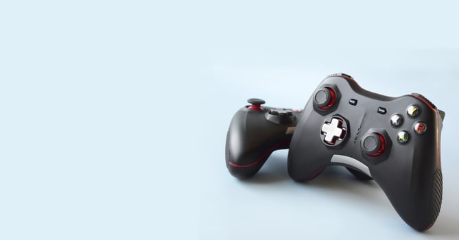 Two joystick gaming controller on light blue background. Minimalism. photo