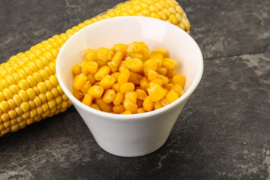 Sweet yellow corn in the bowl photo