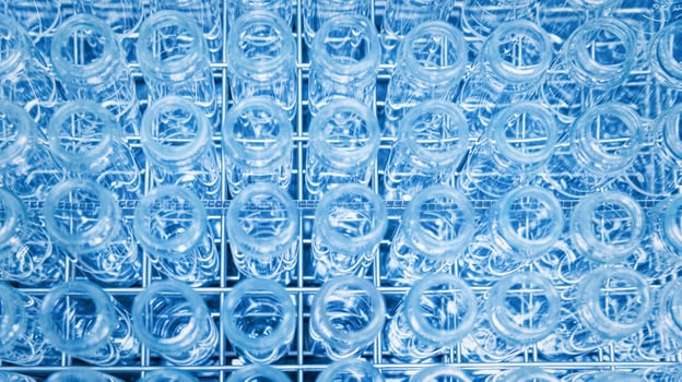 Glass flask with liquid in laboratory. Blue tone. Selective focus. photo