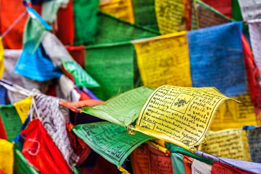 Buddhist prayer flags lungta with prayers, Ladakh photo