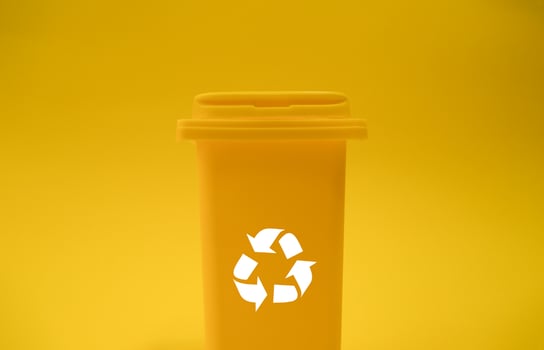 A yellow container on a yellow background photo