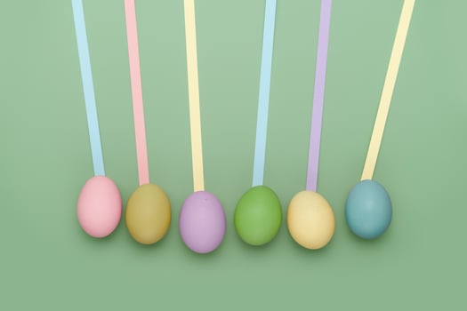 Row of eggs with leading geometric lines. Fun Easter background photo
