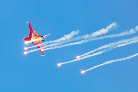 Radom, Poland, 2023 - Swiss Air Force F-5E Tiger fighter jet plane flying. Aviation and military aircraft. Patrouille Suisse aerobatic team. photo