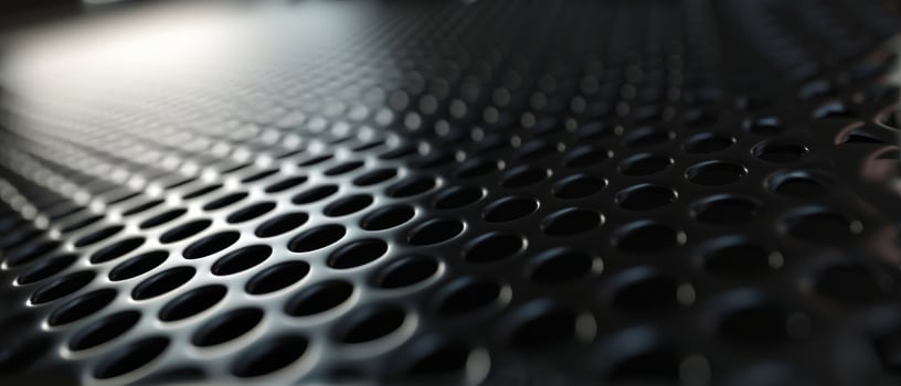 AI generated Macro shot of a black perforated metal surface with circular patterns photo