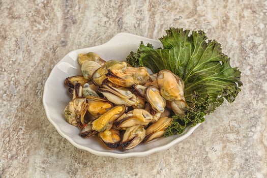 Tasty marinated mussels in the bowl photo