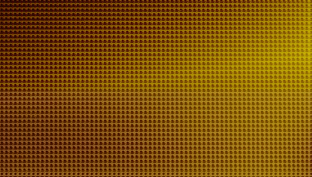 Spot lit perforated pink metal plate photo