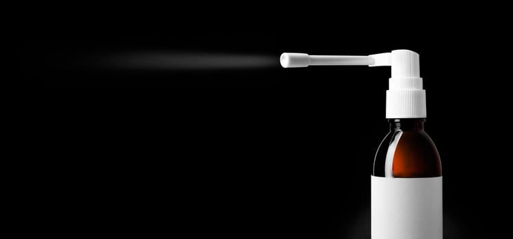 Throast spray medicine isolated on black background. photo
