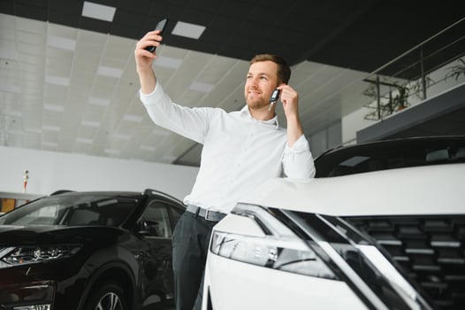 Man adult customer male buyer client chooses auto wants to buy new automobile touch check car in showroom vehicle salon dealership store motor show indoor. Sales concept photo