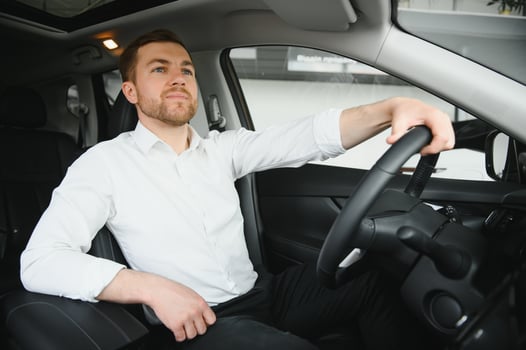 Man buying a car at a showroom photo