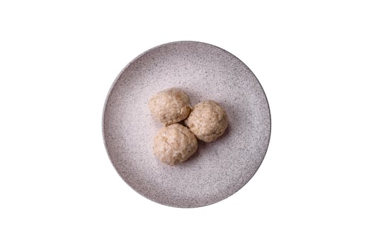 Delicious healthy steamed chicken cutlets or minced meatballs photo
