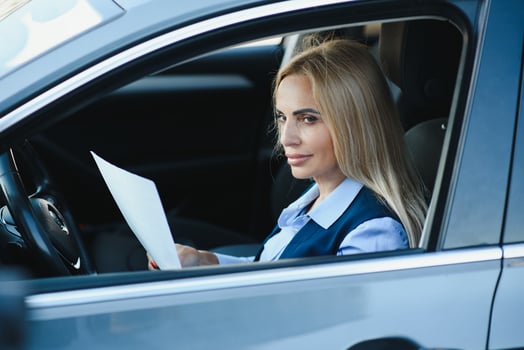 Portrait of business elegant middle-aged woman in car. photo