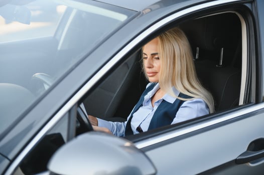 Portrait of business elegant middle-aged woman in car. photo