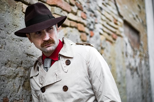Detective walking in the city slums photo