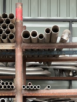 metal profile with pipe of different size in the warehouse photo