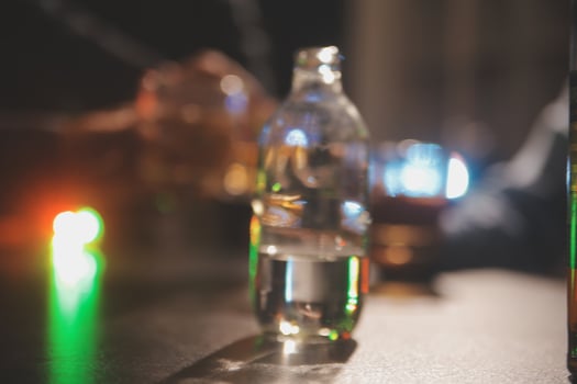 Celebration night, pour whiskey into a glass. Give to friends who come to celebrate photo