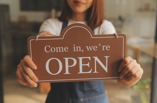 Startup successful small business owner sme beauty girl stand with tablet smartphone in coffee shop restaurant. Portrait of asian tan woman barista cafe owner. SME entrepreneur seller business concept photo
