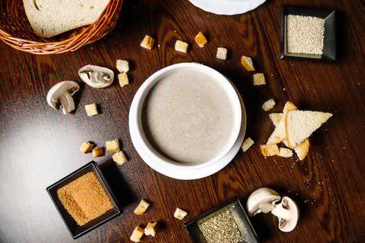 Wooden Table Displaying Variety of Food photo