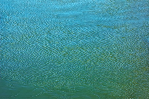 Background of the water surface of the Salzach river. Texture of water of a mountain river. photo