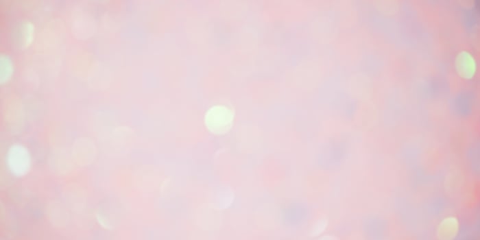Sparkles defocus light. Glitter paper defocus as background. Pink. photo