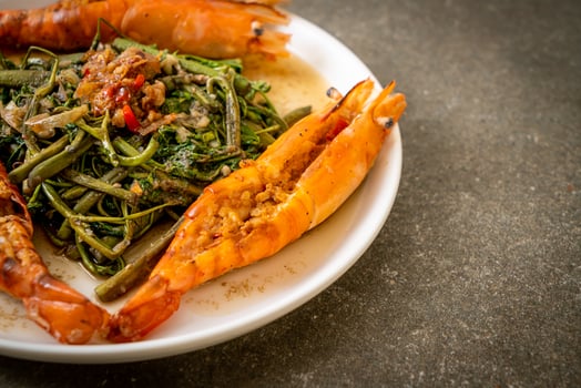 Stir-fried water mimosa with river prawns photo