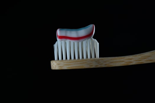 Toothpaste on toothbrush macro photo