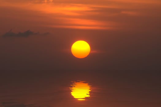 Big sun reflection on the water photo