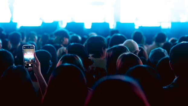 People holding smart phone and recording and photographing in music festival concert photo