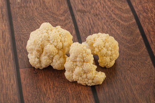 Raw white cauliflower cabbage heap photo