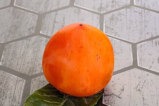 Fresh ripe sweet juicy persimmon photo