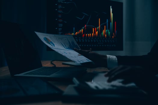 Thoughtful focused successful caucasian male stock investor, broker, financial adviser, sits at work desk, looks at computer, pensively analyze risks and prospects, rise or fall of cryptocurrency coin photo