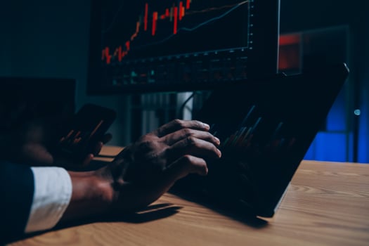 Thoughtful focused successful caucasian male stock investor, broker, financial adviser, sits at work desk, looks at computer, pensively analyze risks and prospects, rise or fall of cryptocurrency coin photo