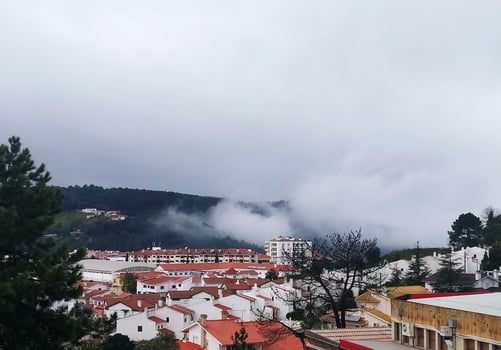 Panoramic view of a traditional Portuguese town, white houses with red tiled roofs. photo