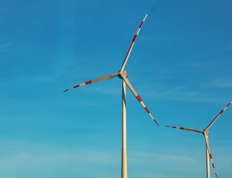 Wind farm park next to a road in Austria in sunny weather. photo