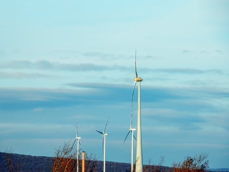 Wind farm park next to a road in Austria in sunny weather. photo